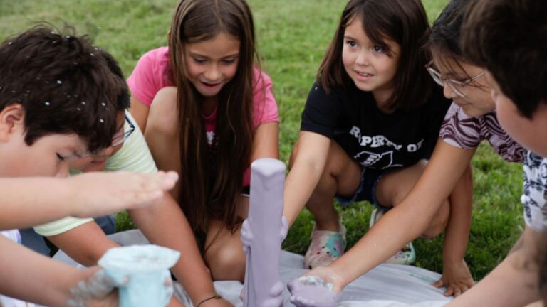 Kids creating elephant toothpaste